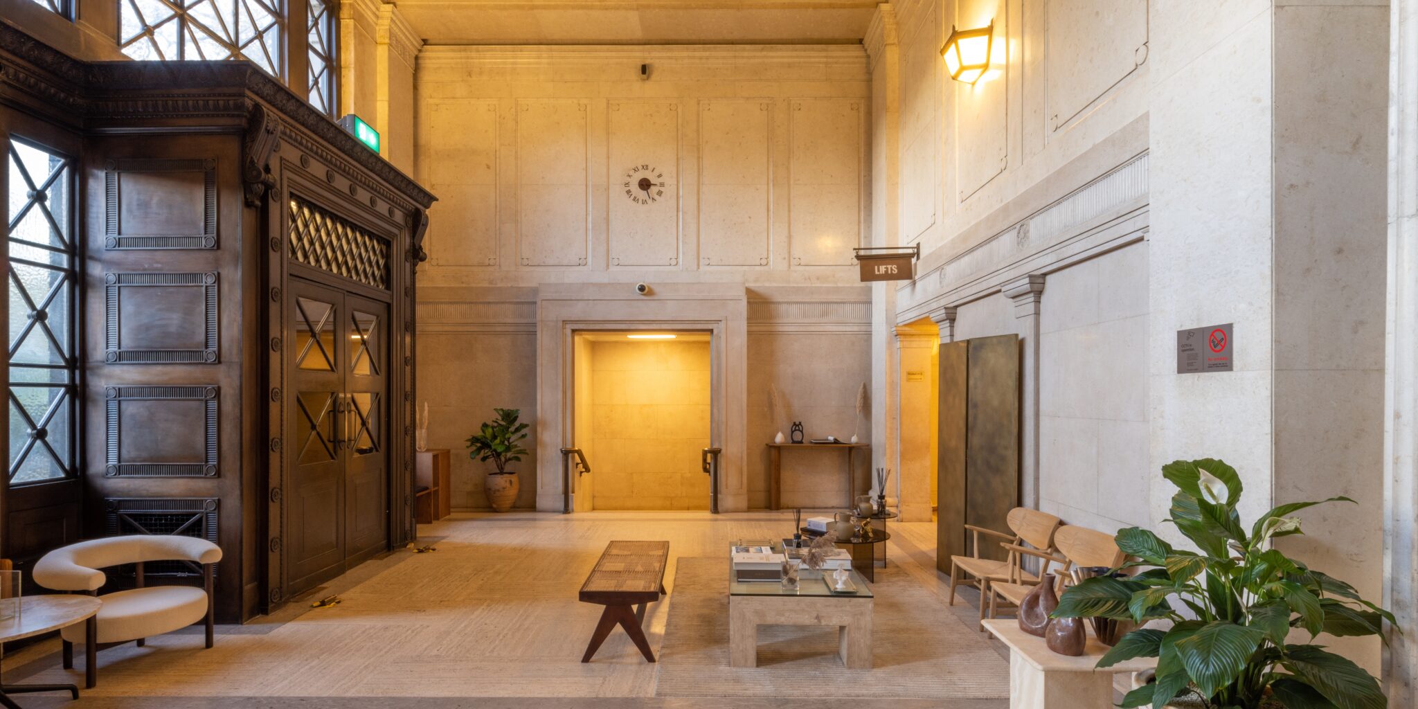 Victoria_House_Atrium_Historic_Modern_Architecture Victoria House's main reception and lobby that leads into the main Atrium space with modern furniture and a plant.