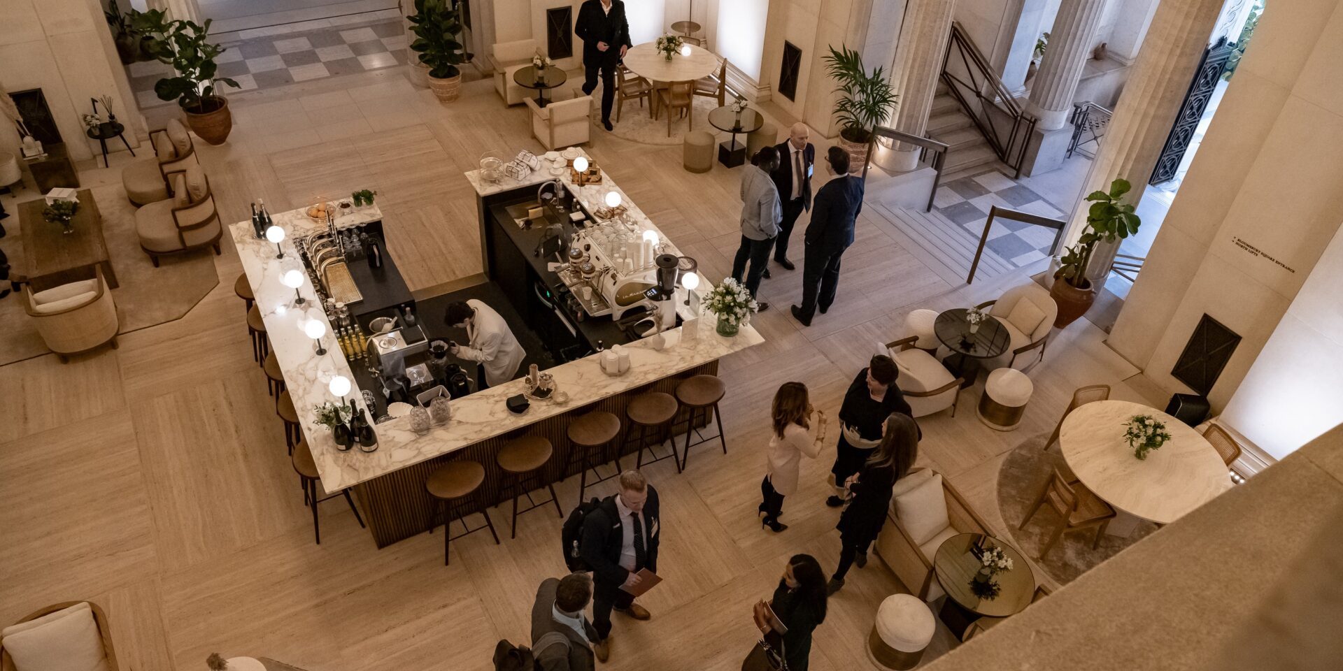 Victoria House Community members networking in the main atrium.