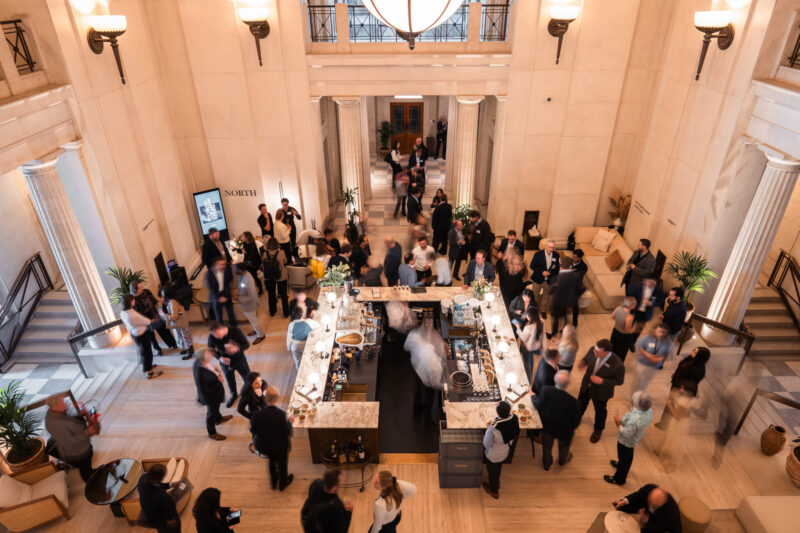 Create-Fund-House People networking in the atrium space at Victoria House.